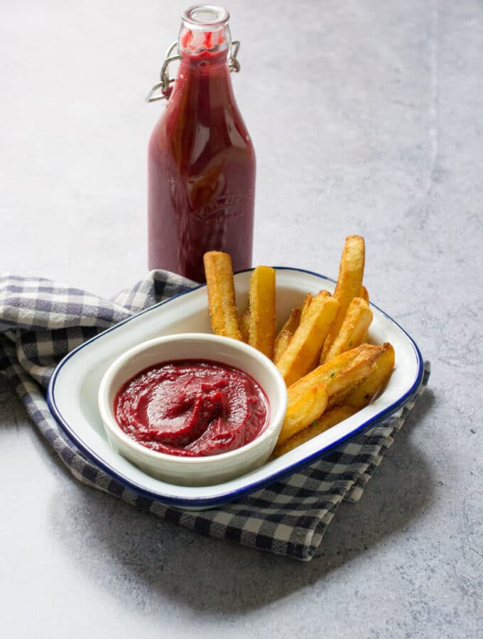 Bottle of Beetroot Ketchup with chips