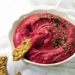 This vegan Beetroot Hummus is packed with flavour, lower-calorie but creamy and delicious, and perfectly pink! #vegan #vegetarian #plantbased | www.thevegspace.co.uk