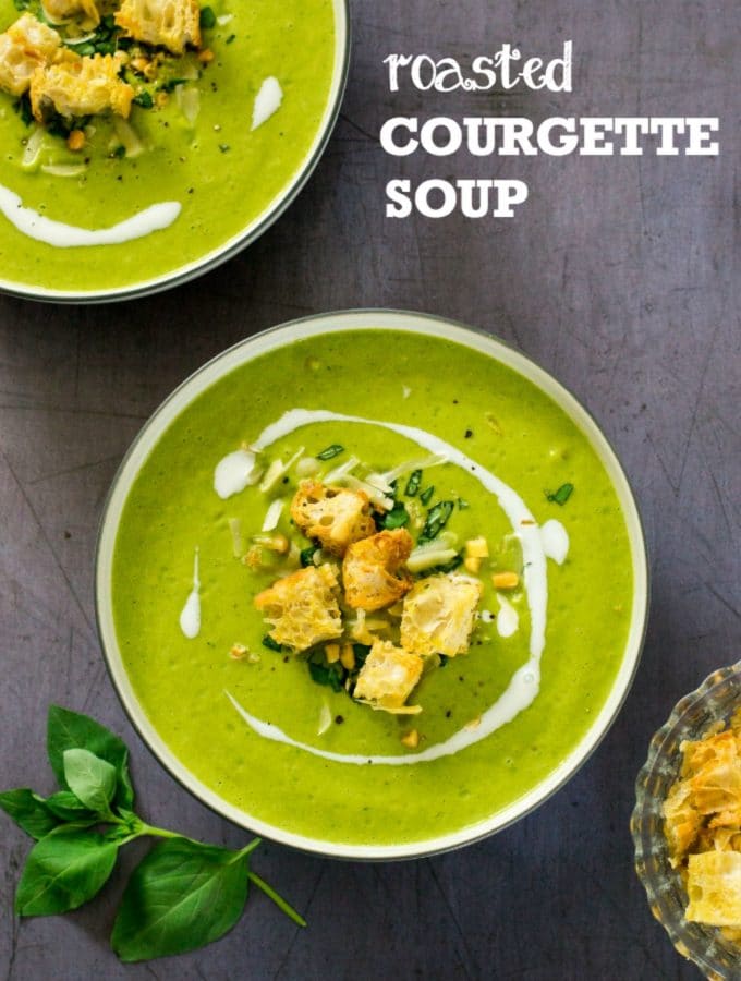 This silky roasted courgette soup is packed with flavour from roasted garlic, peas, basil and vegan parmesan, and topped with crispy ciabatta croutons and pine nuts. #vegan #plantbased #veganfood #vegetarian #soup